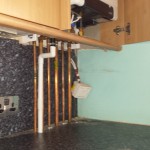 Box in pipework and boiler kitchen